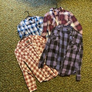 4 womens flannels. Fit like medium